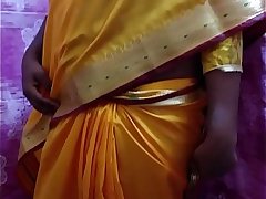 Desi Hot Girl Showing Her Assets Stripping In Saree