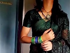 Crossdresser in green saree